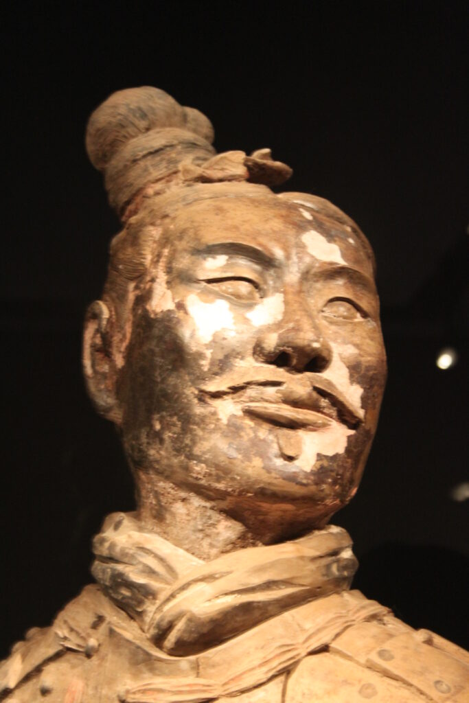 Close view of a Qin terracotta figure with paint traces