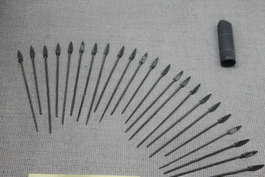 Qin bronze arrows displayed in a museum case