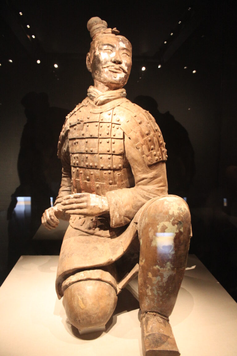 Kneeling terracotta archer with armour and surviving paint traces