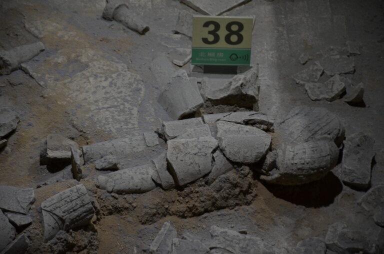 Terracotta warrior fragments in an excavation and restoration context